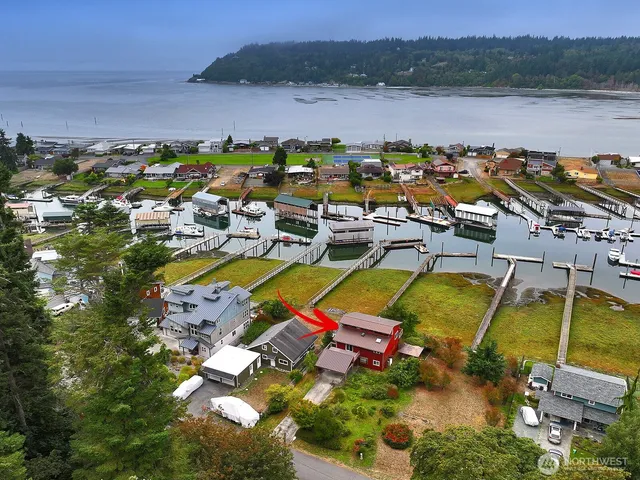 an aerial view of a house with a lake view