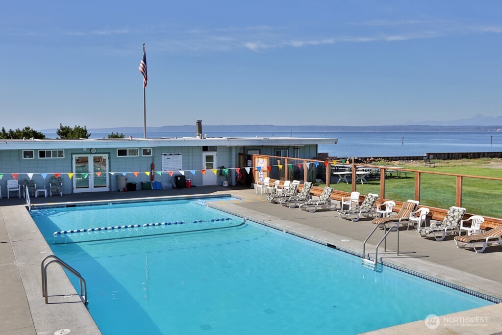 8122 Autumn Lane Clinton, WA 98236 - Photo 34 of 35 a view of a swimming pool with chairs