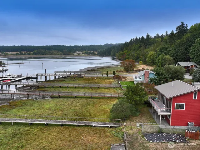 a view of a lake with houses in the background