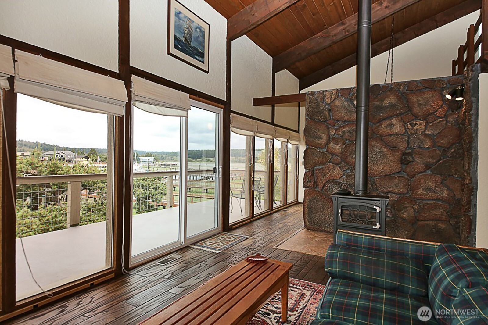 8122 Autumn Lane Clinton, WA 98236 - Photo 10 of 35 a view of a room with wooden floor and windows
