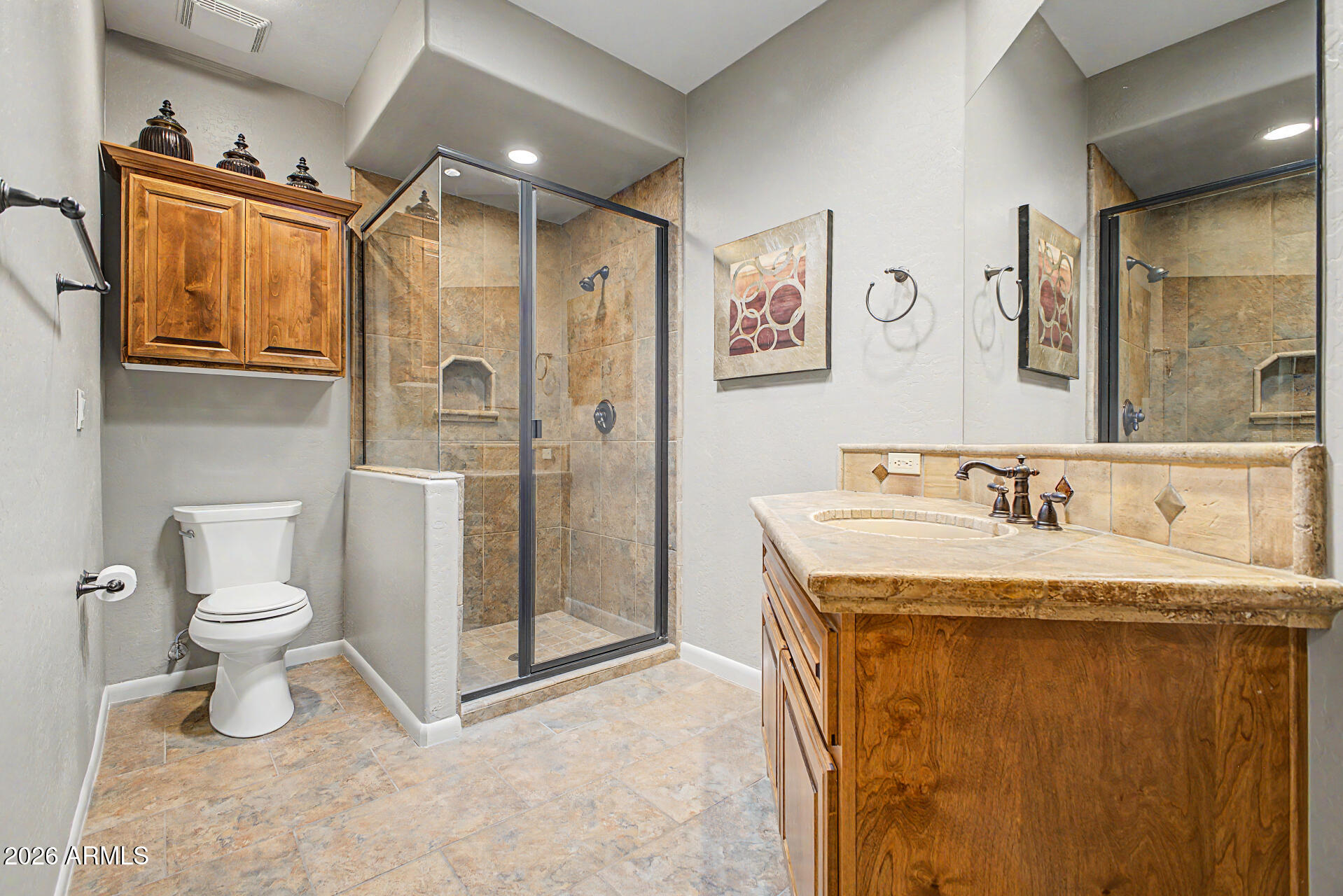 27909 North Quail Spring Road Rio Verde, AZ 85263 - Photo 23 of 52 a bathroom with a granite countertop sink toilet and shower
