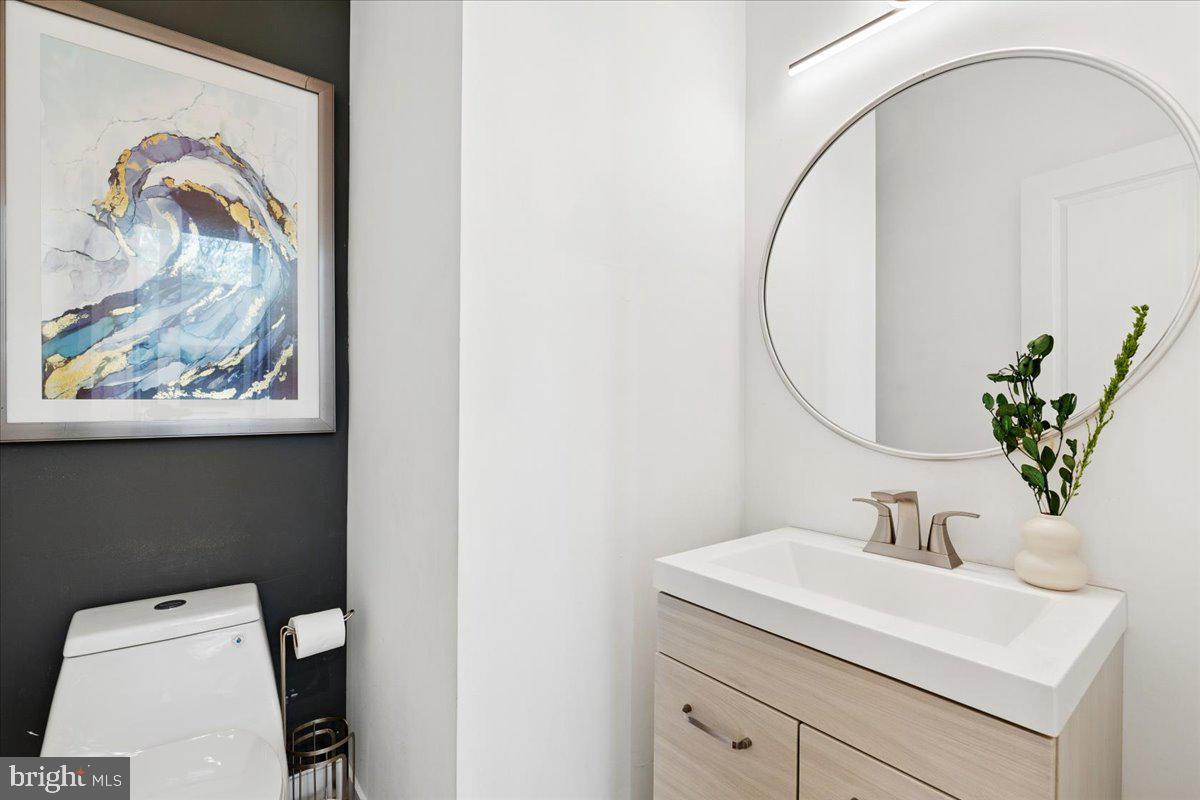 3249 Arundel On The Bay Road Annapolis, MD 21403 - Photo 13 of 88 a bathroom with a sink and mirror