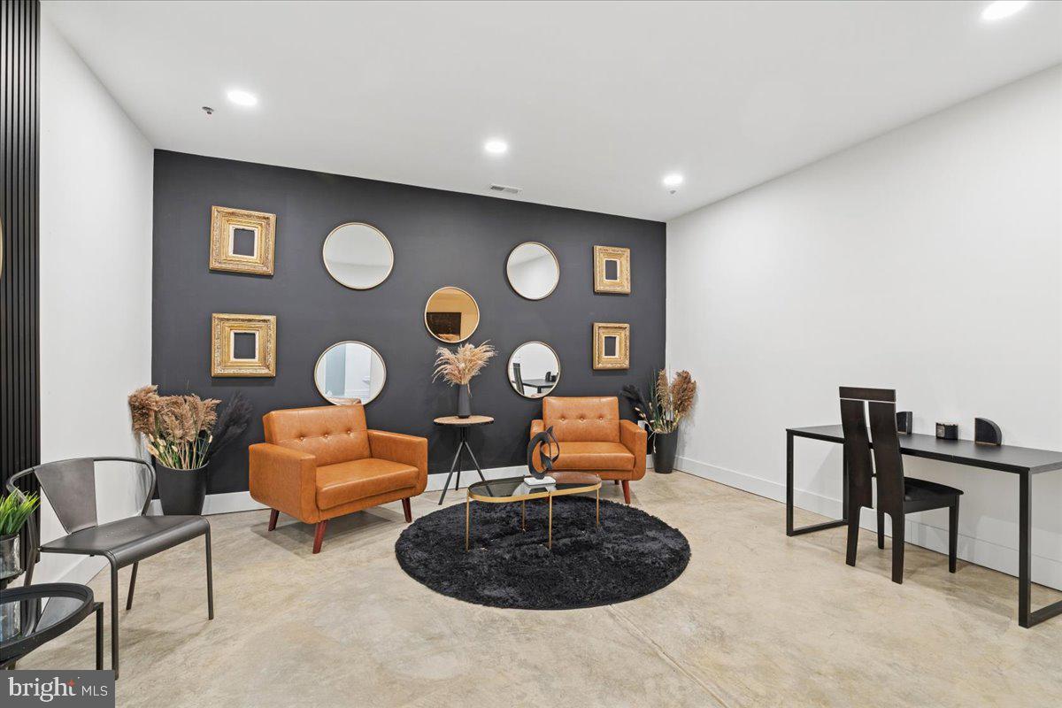 3249 Arundel On The Bay Road Annapolis, MD 21403 - Photo 15 of 88 a living room with furniture and a clock