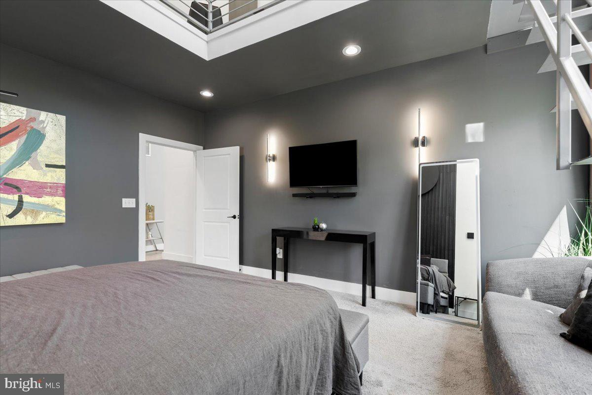 3249 Arundel On The Bay Road Annapolis, MD 21403 - Photo 22 of 88 a bedroom with a bed tv and a window