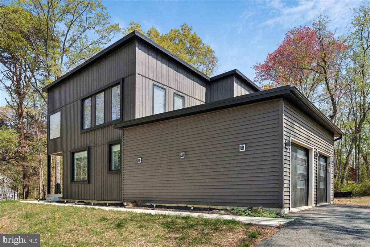 3249 Arundel On The Bay Road Annapolis, MD 21403 - Photo 29 of 88 a view of a house with yard and garage