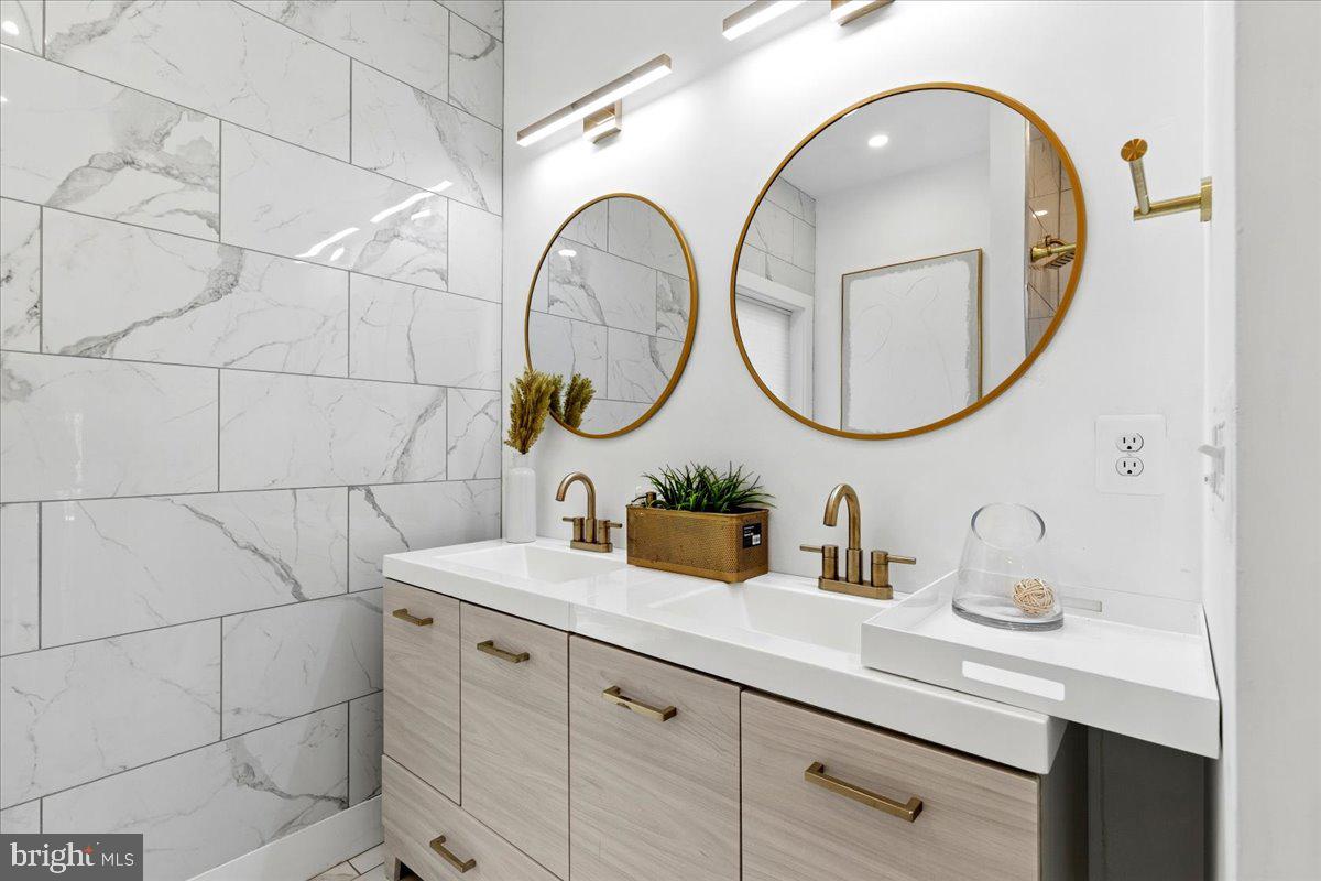 3249 Arundel On The Bay Road Annapolis, MD 21403 - Photo 66 of 88 a bathroom with a sink and a mirror