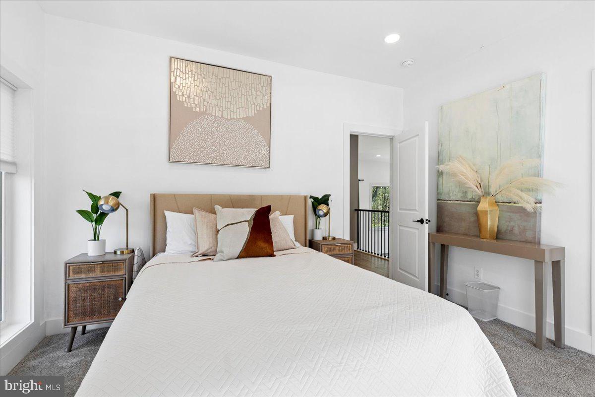 3249 Arundel On The Bay Road Annapolis, MD 21403 - Photo 77 of 88 a bedroom with a large bed and a potted plant