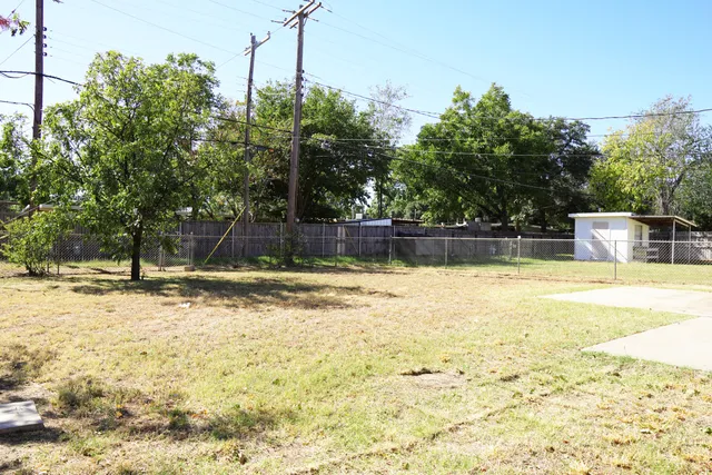 a view of a swimming pool with a house