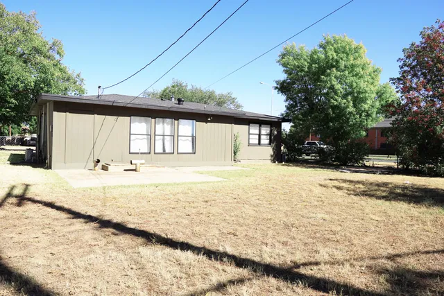 a view of a house with snow on the road