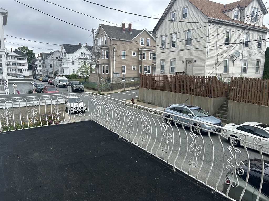 69 Mott Street Fall River, MA 02721 - Photo 3 of 31 a view of a house with wooden deck