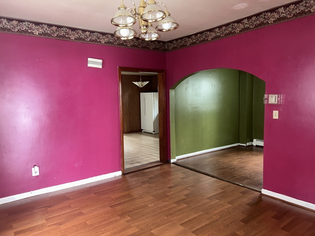 69 Mott Street Fall River, MA 02721 - Photo 6 of 31 a view of a livingroom with a red chair