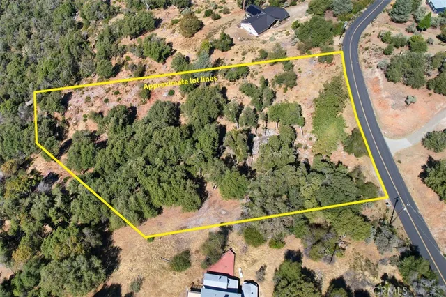 a backyard of a house with a yard and outdoor seating