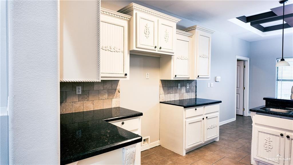 3000 Linva Avenue Edinburg, TX 78541 - Photo 3 of 12 a kitchen with granite countertop a stove and a sink