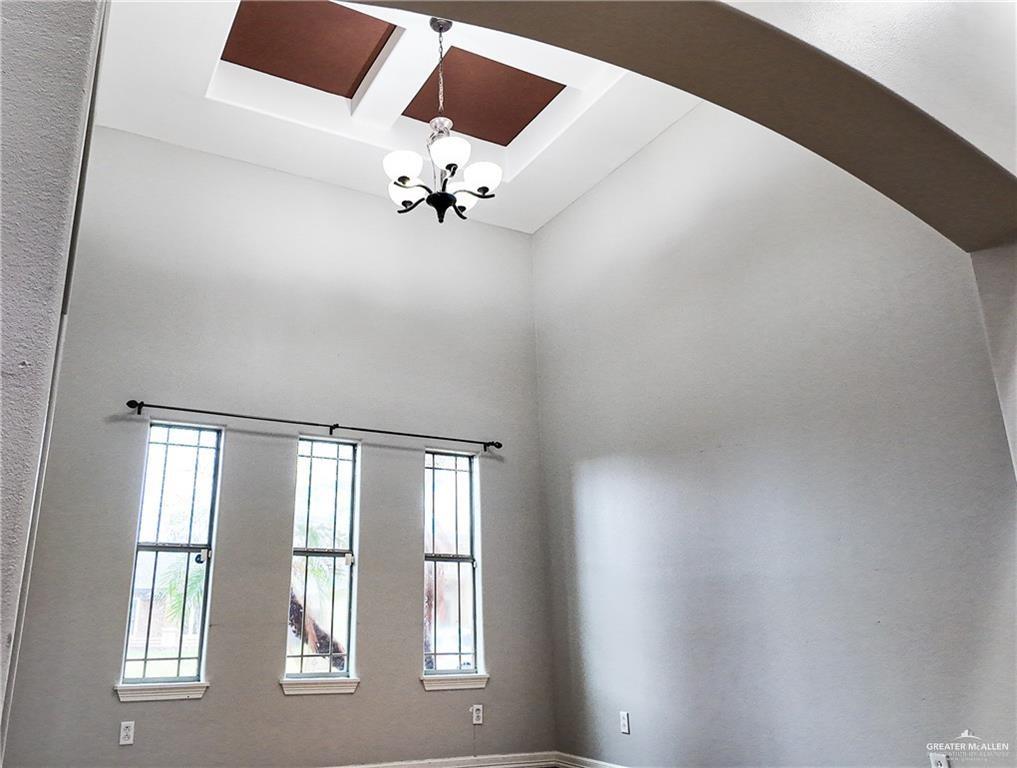 3000 Linva Avenue Edinburg, TX 78541 - Photo 5 of 12 wooden floor in an empty room with a window
