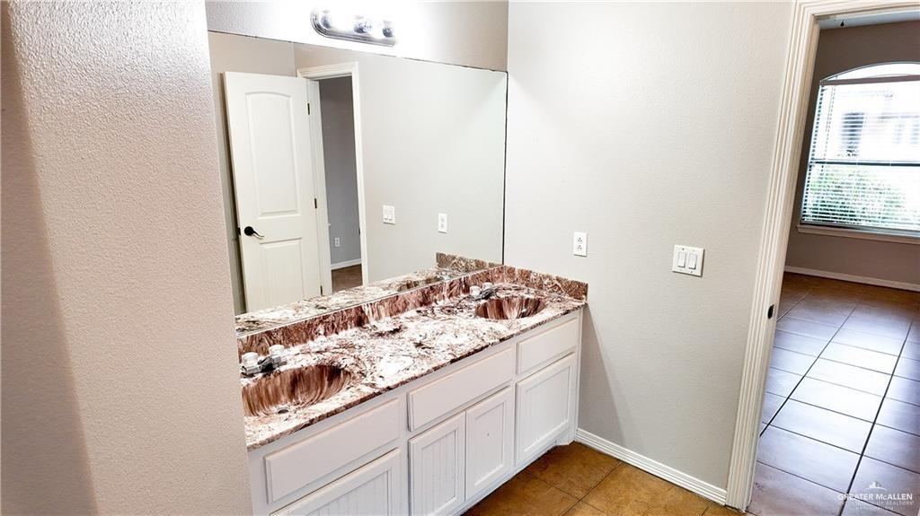 3000 Linva Avenue Edinburg, TX 78541 - Photo 7 of 12 a bathroom with a sink and a mirror