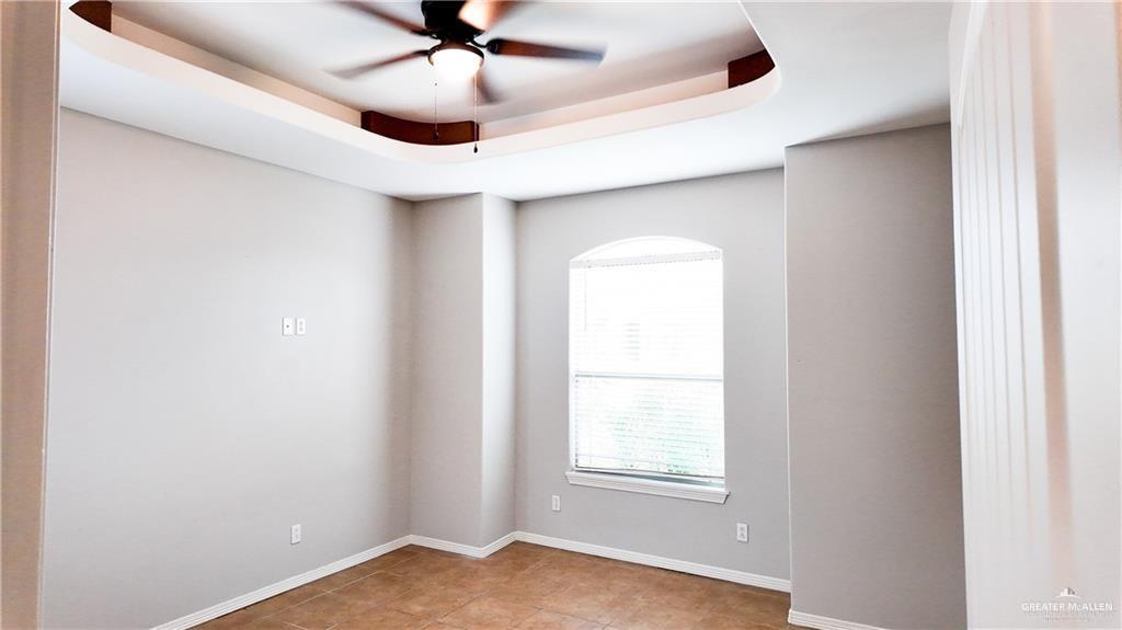 3000 Linva Avenue Edinburg, TX 78541 - Photo 10 of 12 an empty room with windows and fan