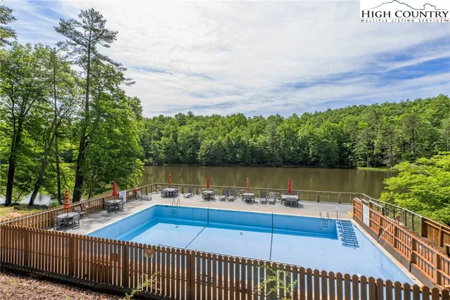 a view of a patio with chairs next to a yard