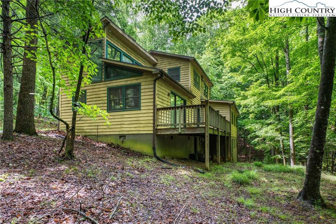 212 Saddle Lane, Unit 29 Deep Gap, NC 28618 - Photo 35 of 35 a view of a house with a yard