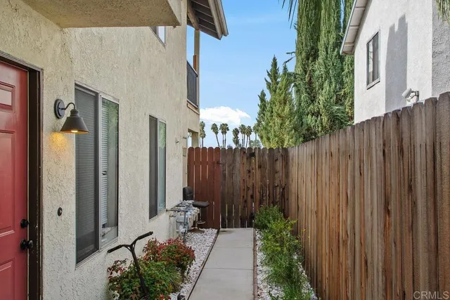a view of a backyard with potted plants