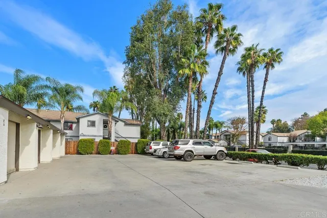 a couple of cars parked in front of a house