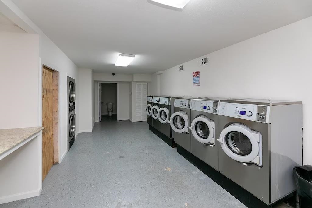 3236 Millington Road Memphis, TN 38127 - Photo 17 of 31 On-site laundry facility featuring multiple front-loading washing machines and stacked dryers