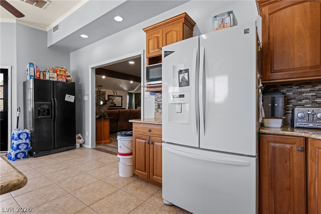 750 Leming Avenue Overton, NV 89040 - Photo 27 of 82 This spacious kitchen offers ample storage and modern appliances for seamless living.