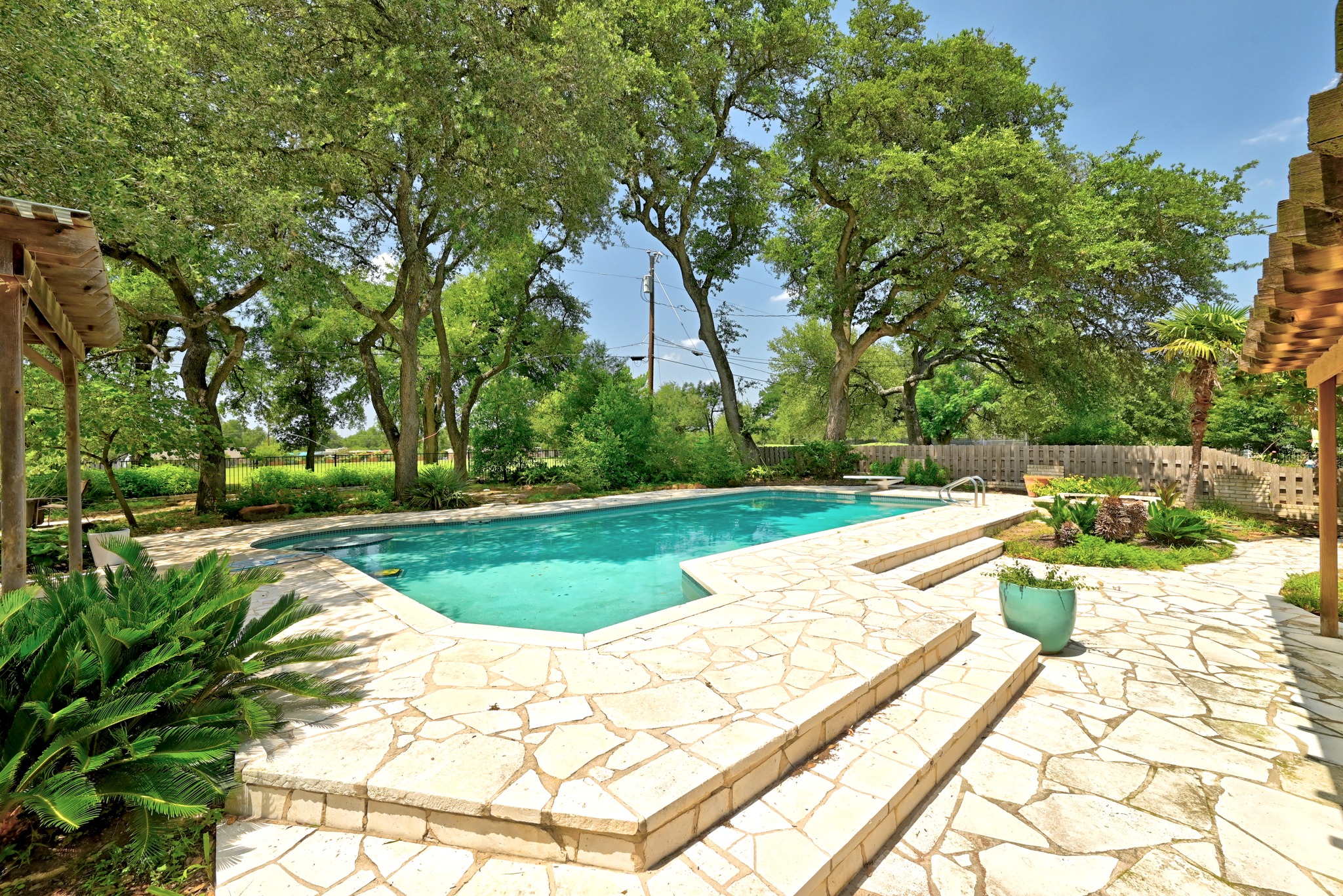 8608 Crest Ridge Circle Austin, TX 78750 - Photo 28 of 38 An inviting swimming pool surrounded by a spacious flagstone patio awaits outdoor enjoyment.