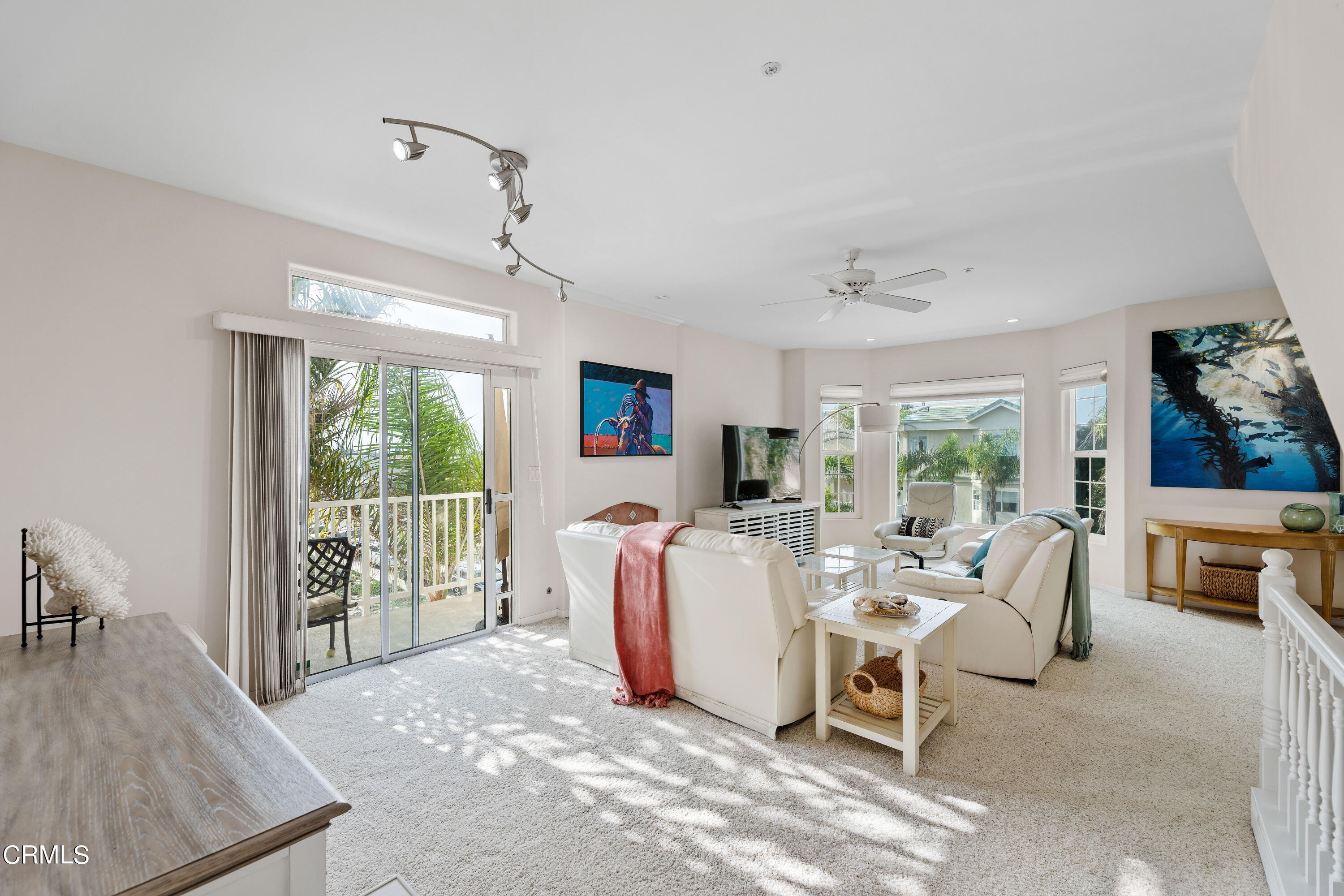 1316 Mandalay Beach Road Oxnard, CA 93035 - Photo 11 of 33 a living room with furniture a large window and a rug