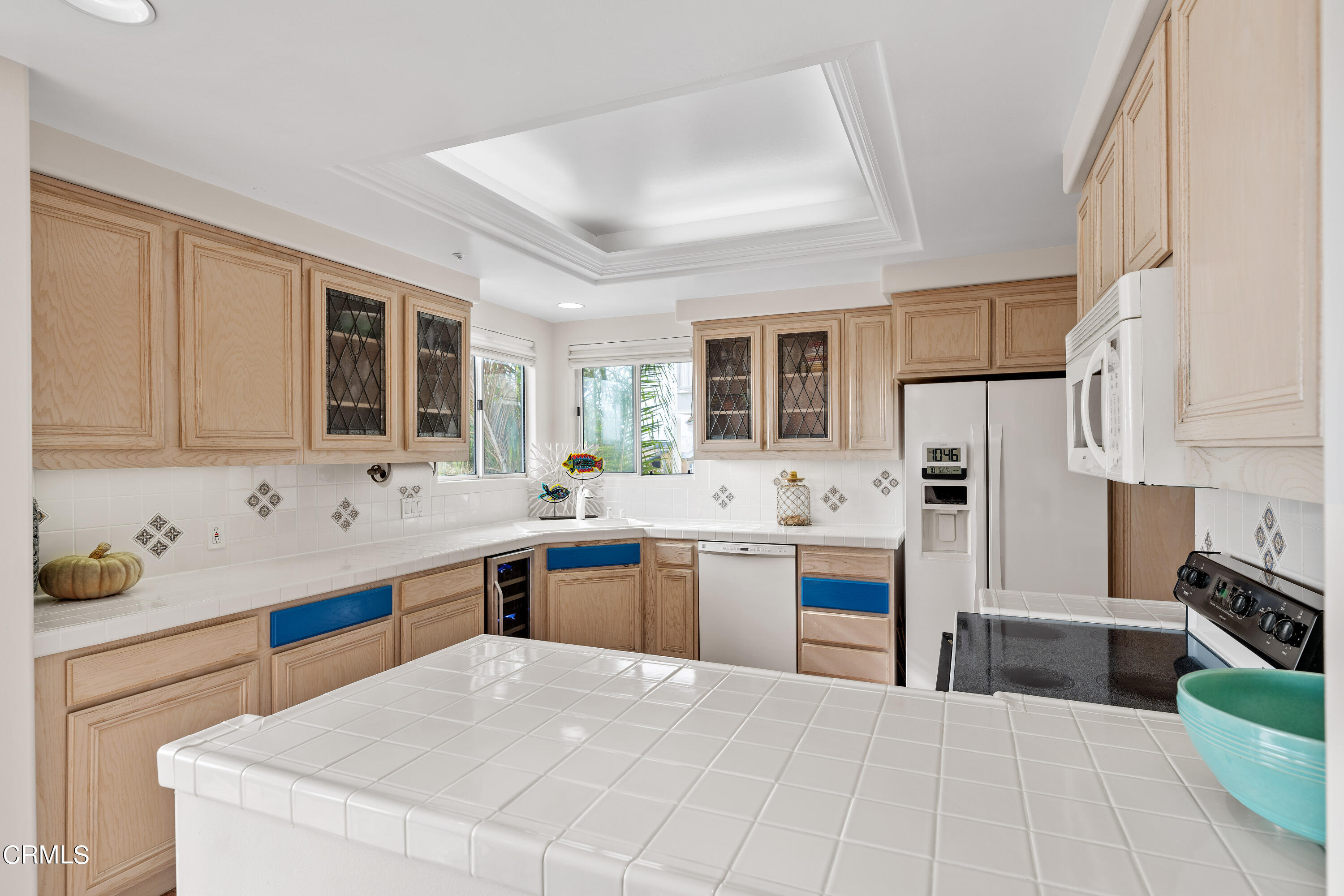 1316 Mandalay Beach Road Oxnard, CA 93035 - Photo 16 of 33 a kitchen with stainless steel appliances a sink stove and cabinets
