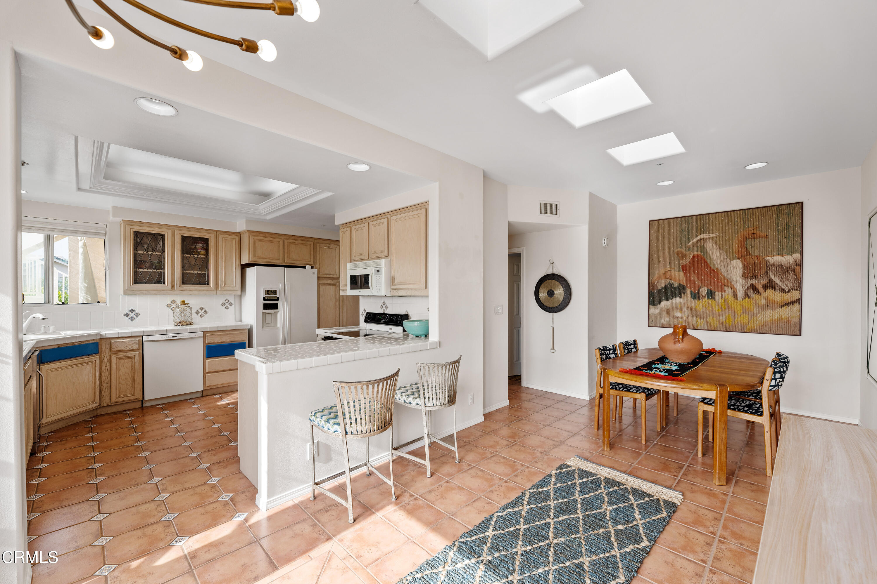 1316 Mandalay Beach Road Oxnard, CA 93035 - Photo 17 of 33 a living room with furniture a dining table and wooden floor