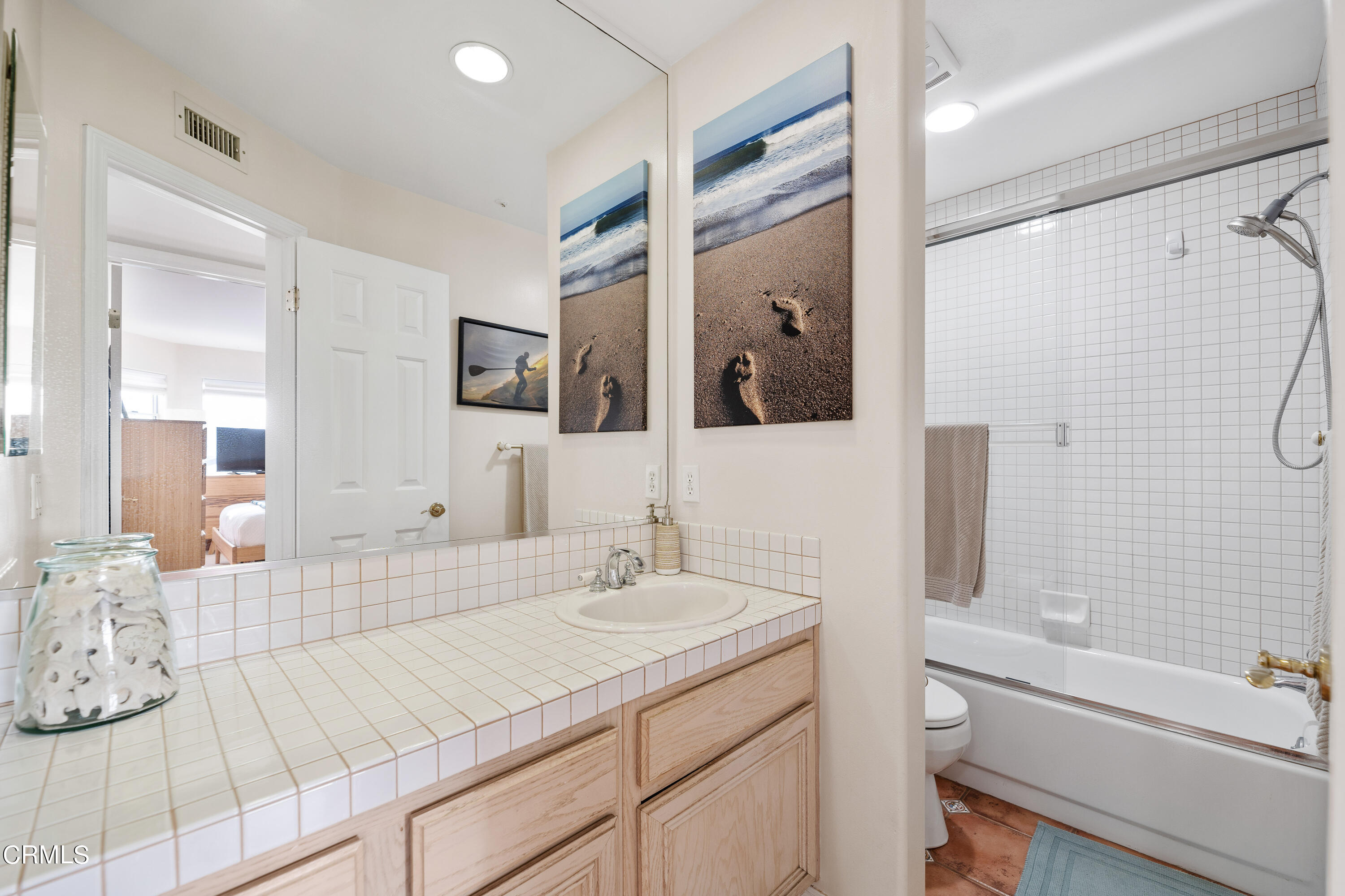 1316 Mandalay Beach Road Oxnard, CA 93035 - Photo 28 of 33 a bathroom with a sink double vanity granite tub shower and a mirror