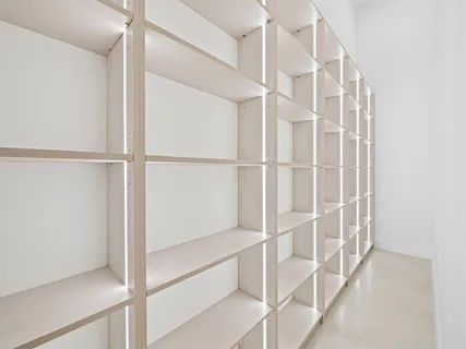 a view of staircase with empty racks