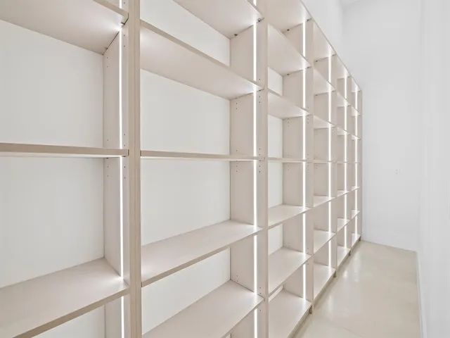 a view of staircase with empty racks