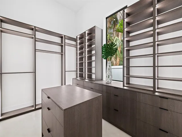 a kitchen with a refrigerator and a sink