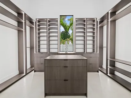 a kitchen with a cabinets and a window