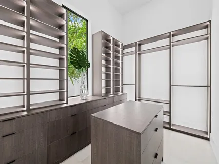 a kitchen with a refrigerator and a window