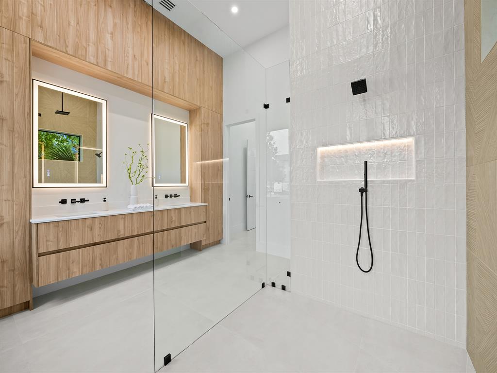 1717 Northeast 17th Terrace Fort Lauderdale, FL 33305 - Photo 26 of 40 a bathroom with a tub sink and mirror