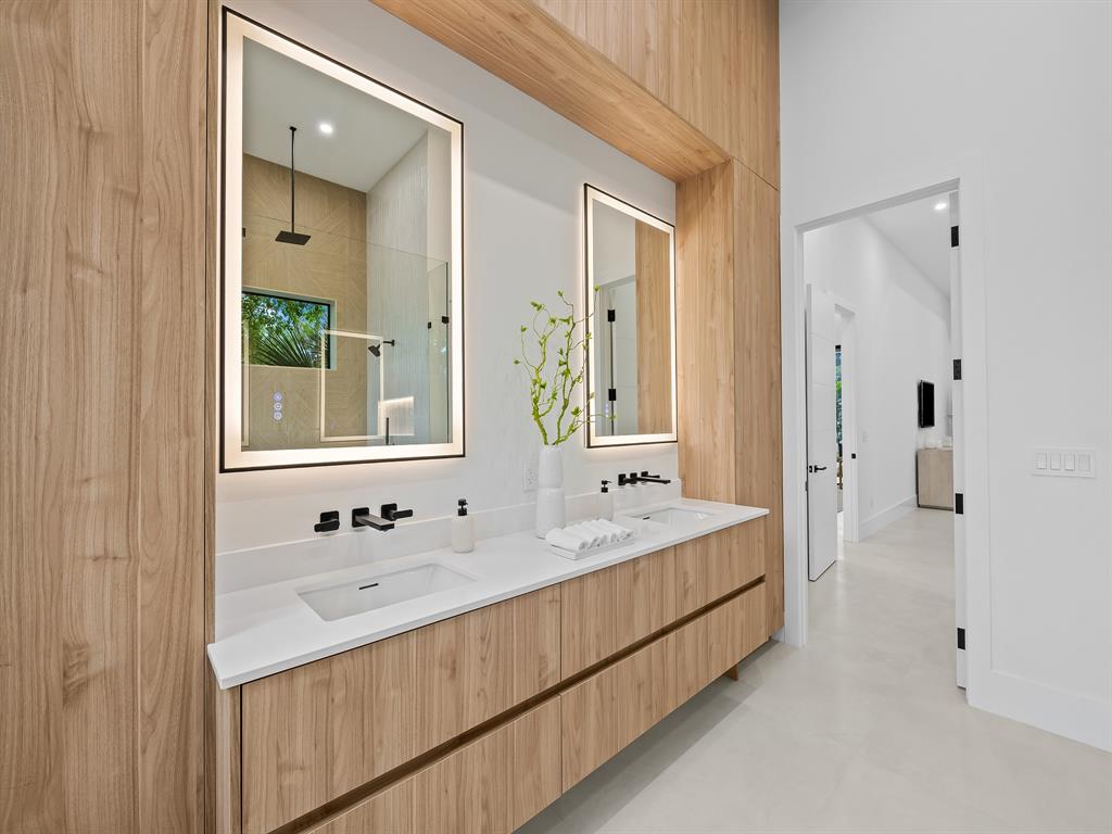 1717 Northeast 17th Terrace Fort Lauderdale, FL 33305 - Photo 27 of 40 a bathroom with a double vanity sink mirror and
