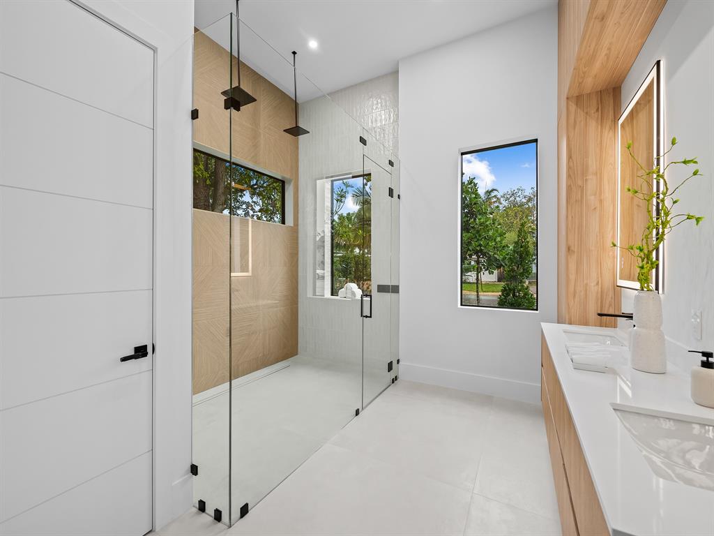 1717 Northeast 17th Terrace Fort Lauderdale, FL 33305 - Photo 28 of 40 a bathroom with a tub and shower