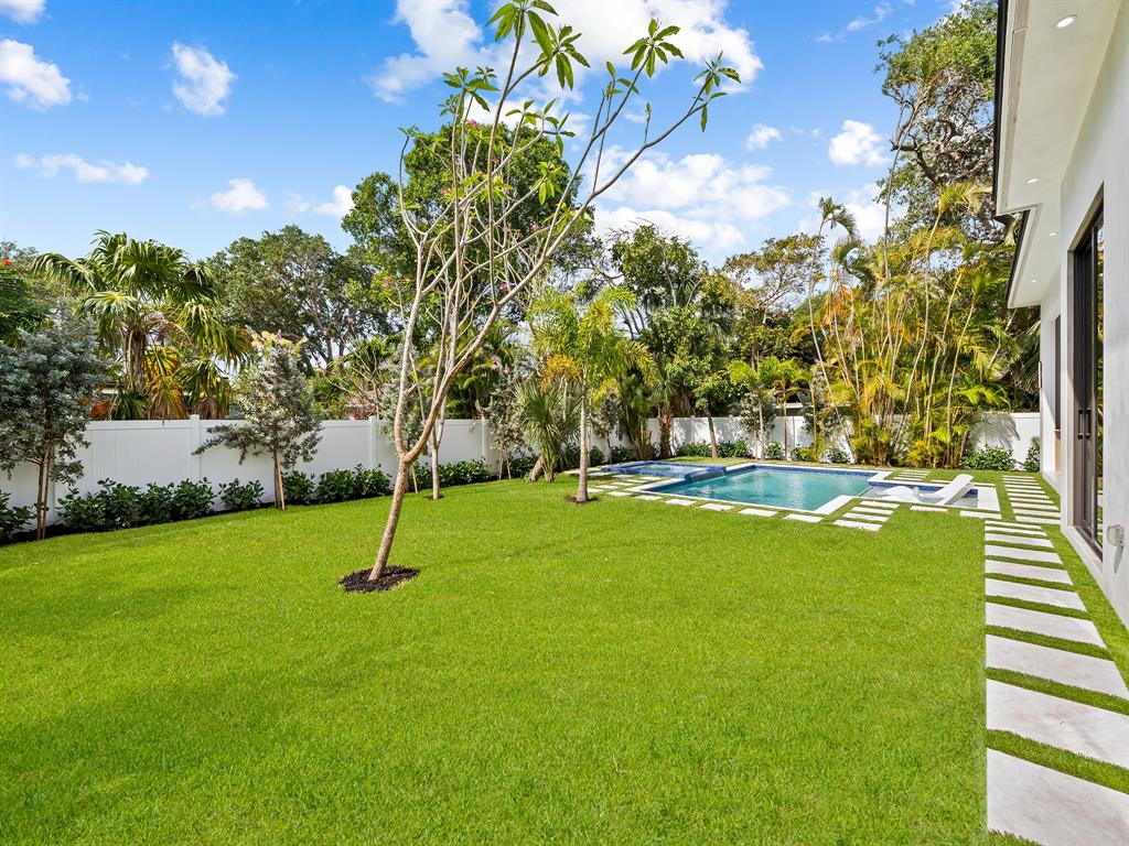 1717 Northeast 17th Terrace Fort Lauderdale, FL 33305 - Photo 9 of 40 a view of yard with swimming pool and green space