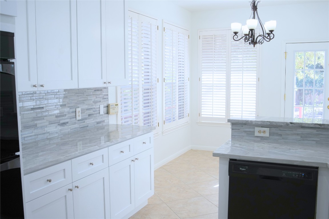 9501 Aire Libre Drive Austin, TX 78726 - Photo 13 of 38 a bathroom with a sink and a granite counter tops