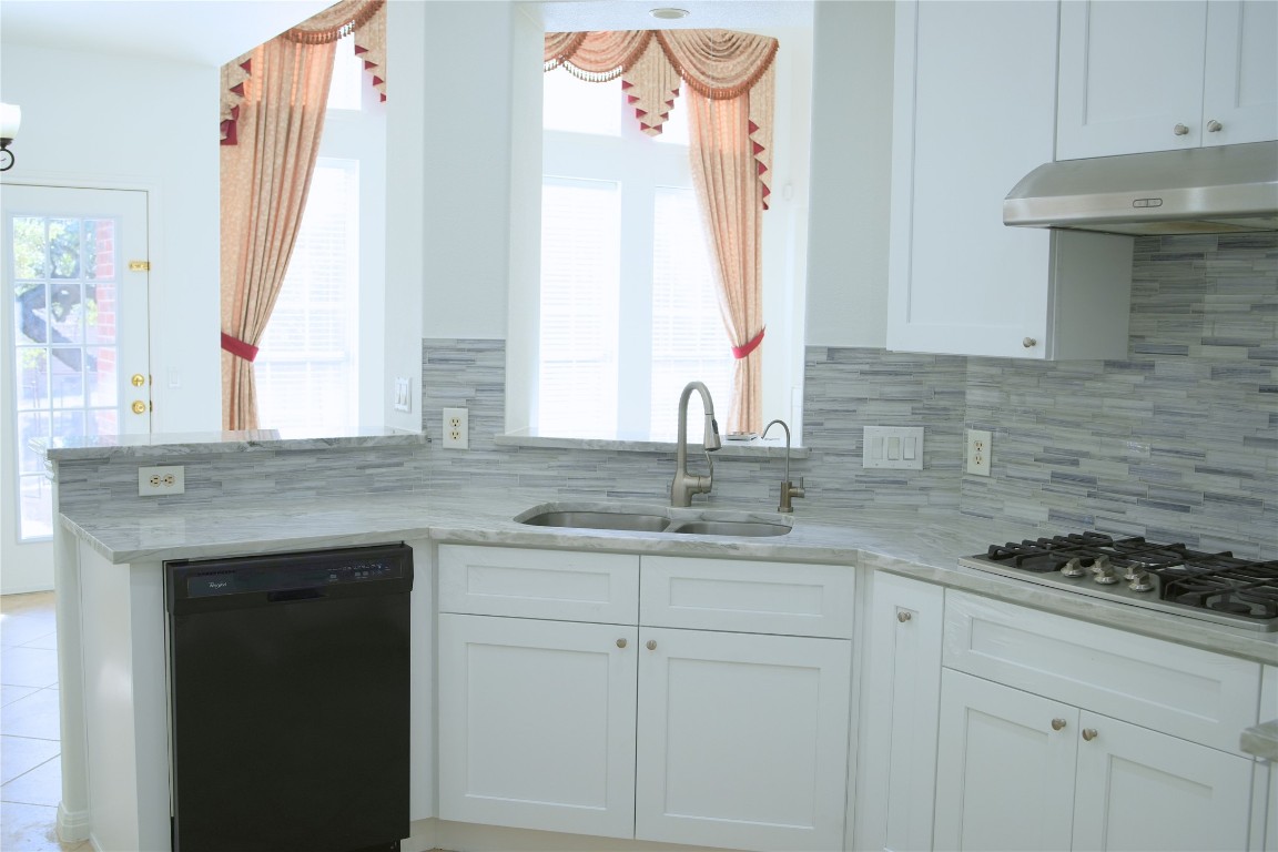 9501 Aire Libre Drive Austin, TX 78726 - Photo 15 of 38 a kitchen with a sink and cabinets