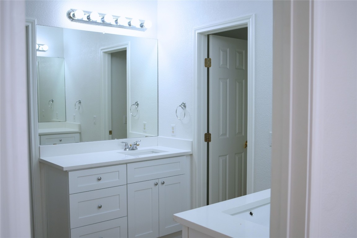 9501 Aire Libre Drive Austin, TX 78726 - Photo 18 of 38 a bathroom with a sink and a mirror