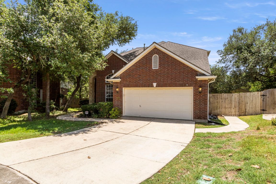 9501 Aire Libre Drive Austin, TX 78726 - Photo 2 of 38 a front view of a house with a yard