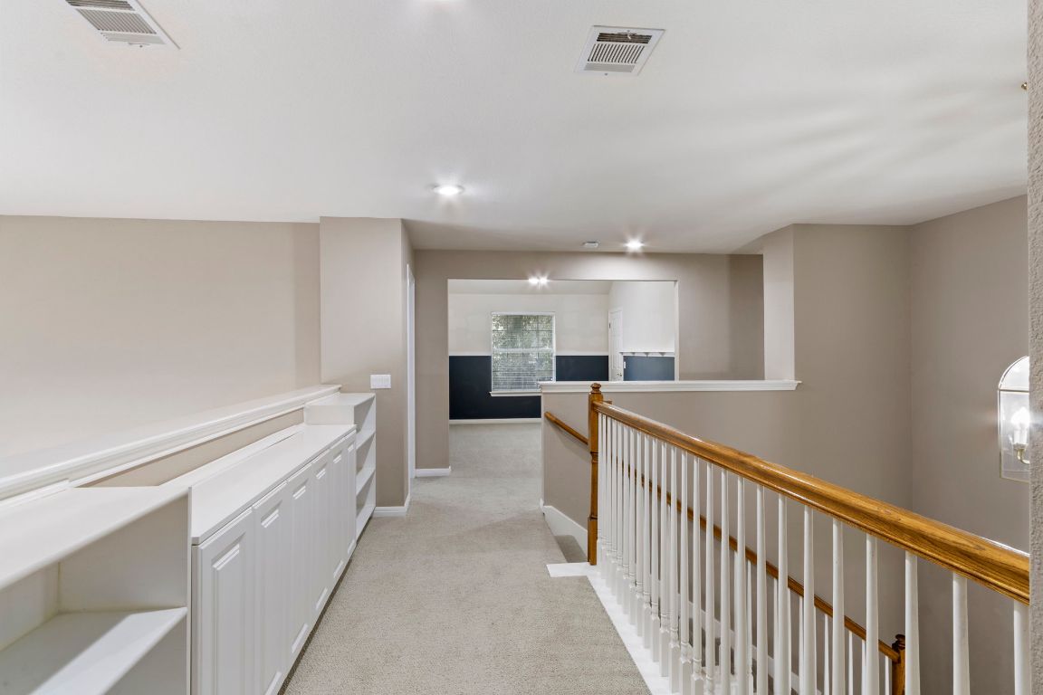 9501 Aire Libre Drive Austin, TX 78726 - Photo 27 of 38 a view of a hallway to kitchen