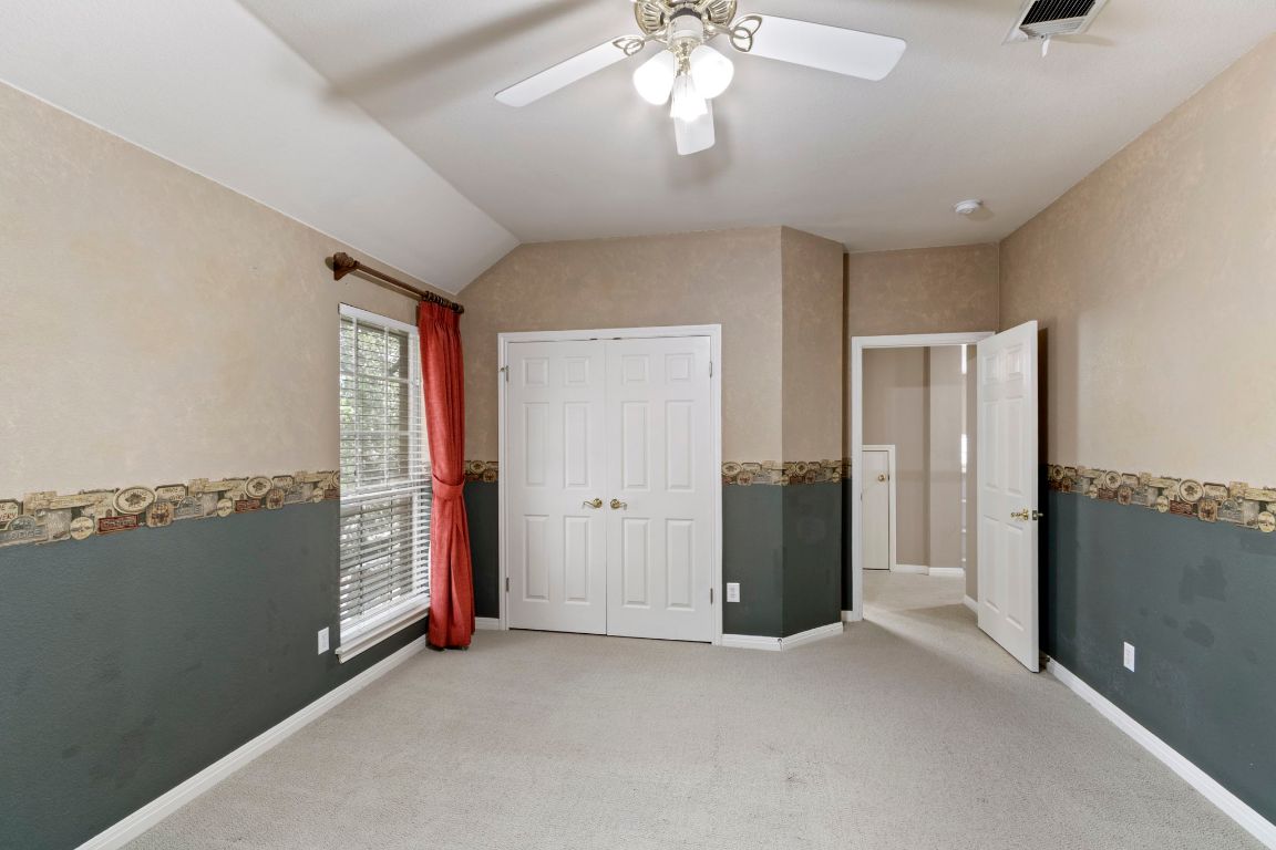 9501 Aire Libre Drive Austin, TX 78726 - Photo 28 of 38 en empty room with windows and closet