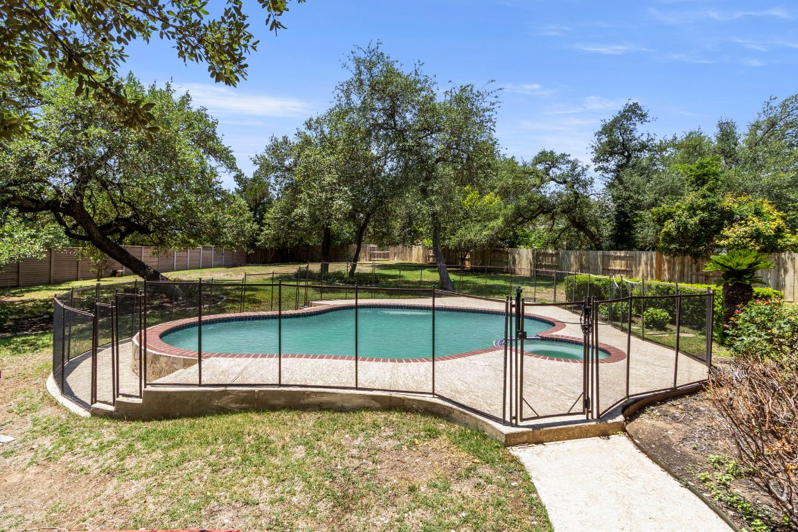 9501 Aire Libre Drive Austin, TX 78726 - Photo 31 of 38 a view of a swimming pool with a bench