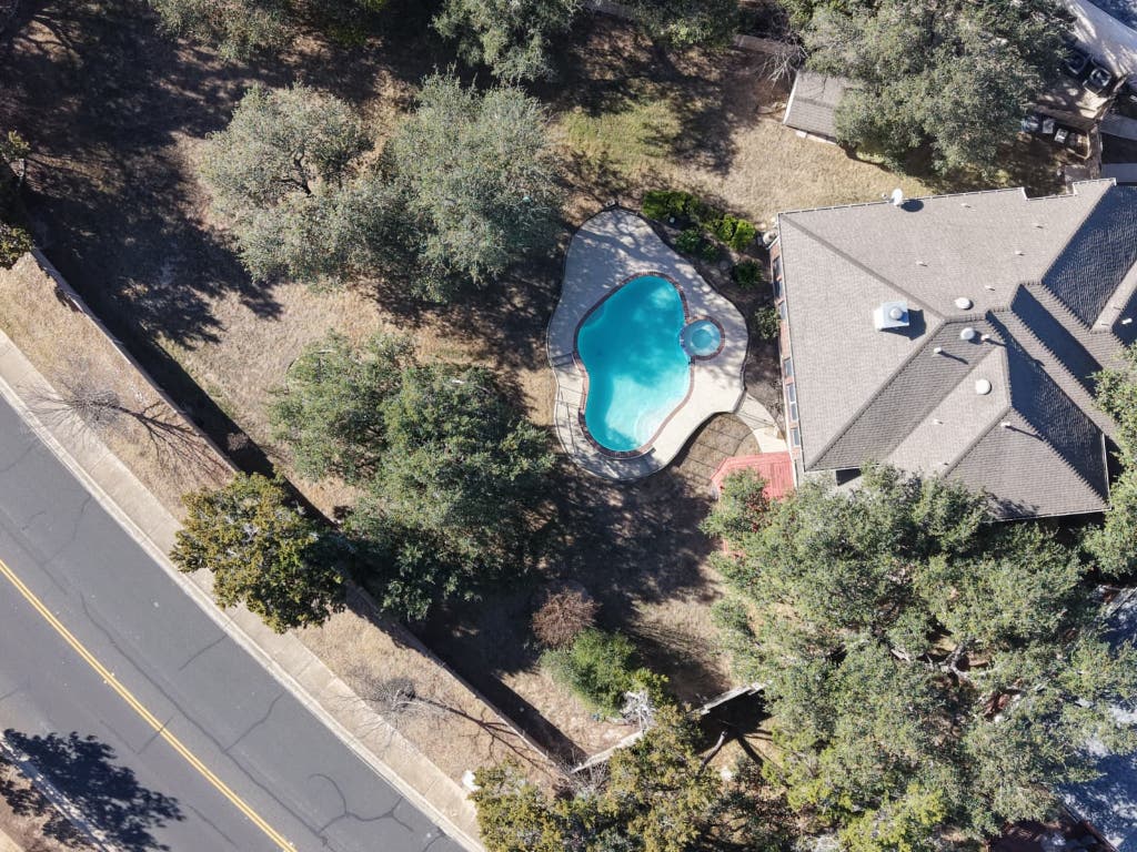 9501 Aire Libre Drive Austin, TX 78726 - Photo 38 of 38 a aerial view of a house with a yard and a large tree