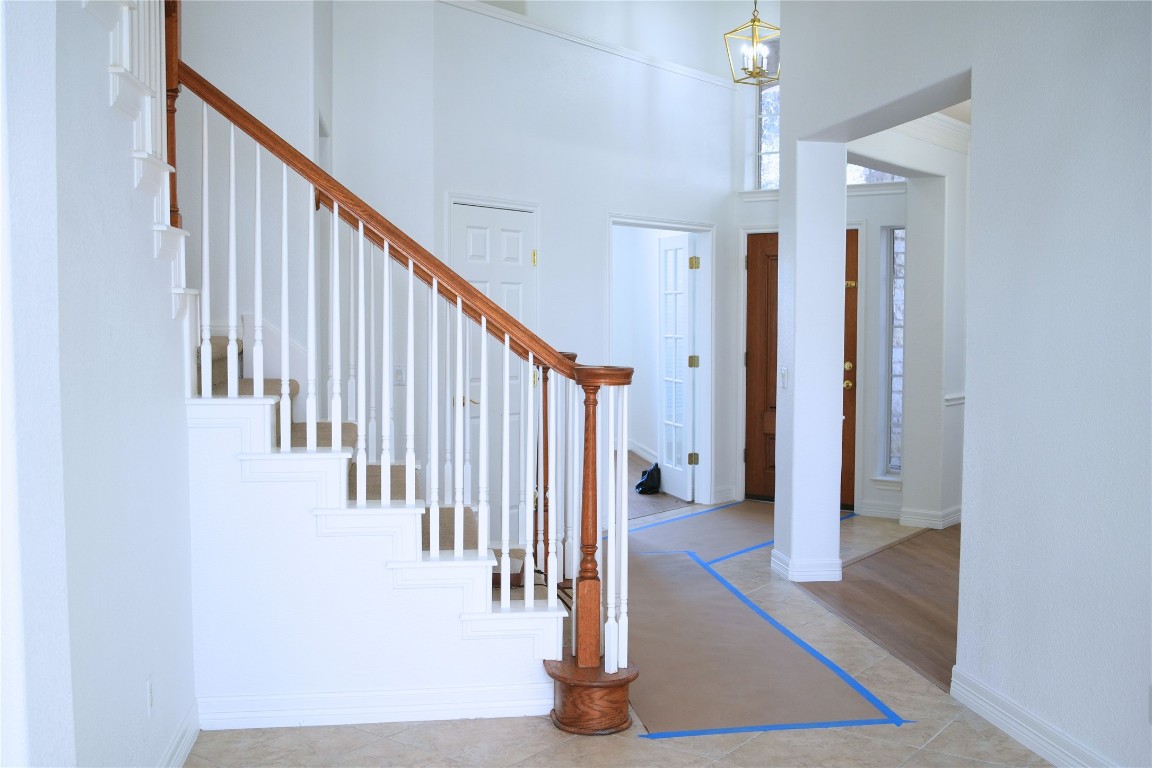 9501 Aire Libre Drive Austin, TX 78726 - Photo 4 of 38 a view of staircase with lots of frames and a rug