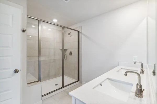 a bathroom with a sink and shower